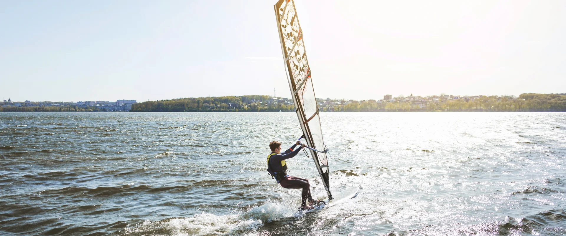 young man with kitesurf board